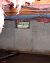 Pennsylvania, New Jersey, and Delaware crawl space with vents, showing mold, rot, and fiberglass insulation dripping off the ceiling.
