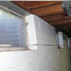 A foundation showing severe inward buckling along the windows in a Doylestown home.