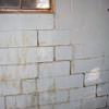 A cracked foundation wall near a window in a Camden home