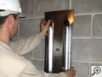 Mounting a foundation wall plate for an earth anchor installation in Norristown.
