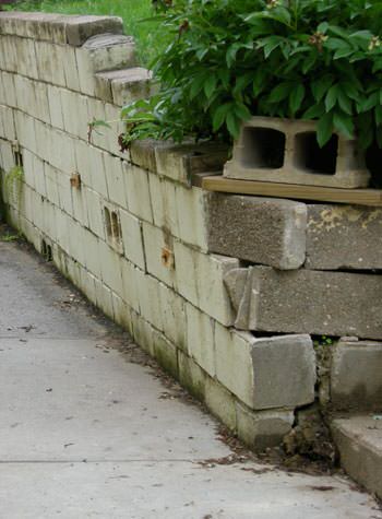 collapsing retaining wall with severe damage in Reading