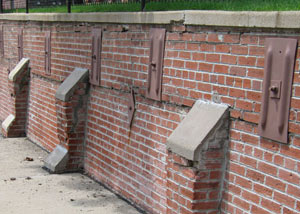 Rusted wall plate anchors in a retaining wall repair in Chester.