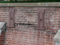 A collapsing, crumbling retaining wall in Norristown