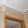 The ceiling and wall separating as the wall sinks with the slab floor in a New Castle home