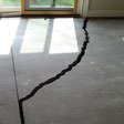 a huge crack in a concrete slab floor in Reading