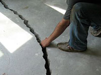 a severely damaged cracked concrete slab floor in Philadelphia