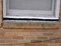 A window sill cracking and separating from the foundation wall in a Newark home.