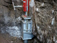 Foundation repair contractors lifting a structure in Newark.