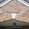 Major tuckpointing on a home archway over a door, with tuckpointing several inches wide that has failed on a Philadelphia home