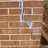 Tuckpointing that cracked due to foundation settlement of a Newark home