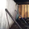Temporary foundation wall supports stabilizing a Camden home