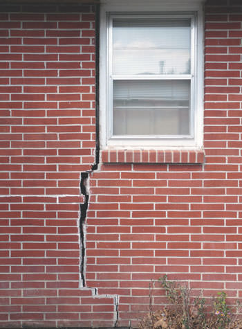 severe foundation wall cracks along a window in Camden