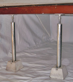 Crawl space jack posts installed in conjunction with a crawl space vapor barrier in Vineland