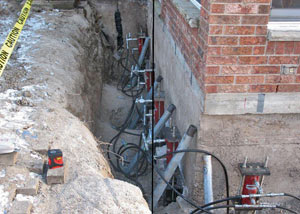Foundation push piers installed around a house with a foundation settlement issues in Vineland