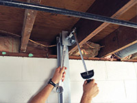 Straightening a foundation wall with the PowerBrace™ i-beam system in a Chester home.