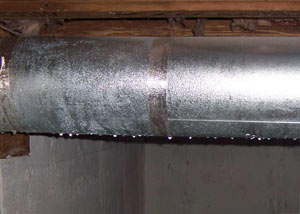 condensation collecting on an HVAC vent in a humid Villanova basement