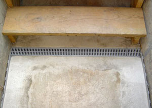 Our grated drain system installed on a leaking basement staircase in Vineland.
