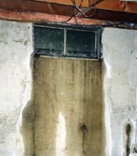 Flooding through basement windows in a Bensalem home.