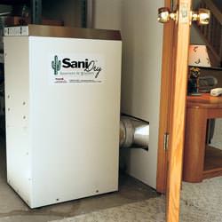 A basement dehumidifier with an ENERGY STAR® rating ducting dry air into a finished area of the basement  in Bensalem