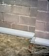 Our baseboard drain system installed on a corner in a Vineland basement.