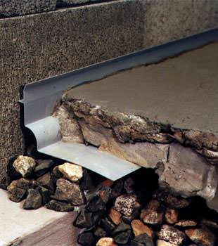 a custom designed basement drain system for thin basement floors in Camden.