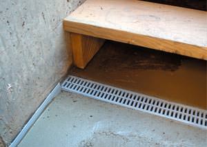 a hatchway entrance in Philadelphia that has been protected from flooding by our TrenchDrain basement drainage system.