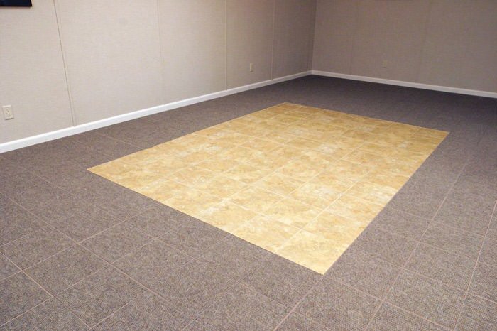 tiled and carpeted basement flooring installed in a Trenton home