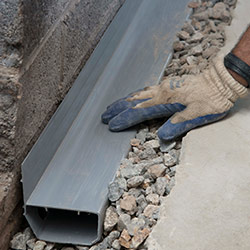 installing a drain tile system in a Reading home